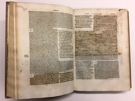 Shows two pages of Canto XIX; areas blacked out with ink removed